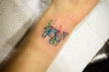 Colored paper elephant with flying bird tattoo