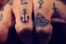 Colored shark and anchor tattoos