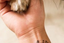 Dog name tattoo on the wrist