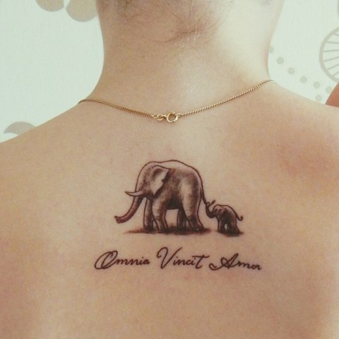 Elephant with baby elephant tattoo on the back