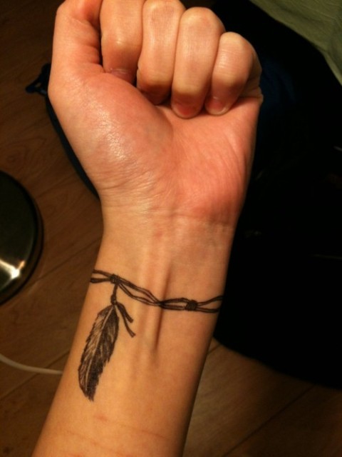 Feather bracelet tattoo