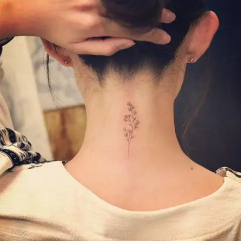 Gentle floral tattoo on the neck