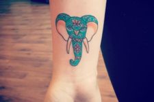 Green and pink elephant on the wrist