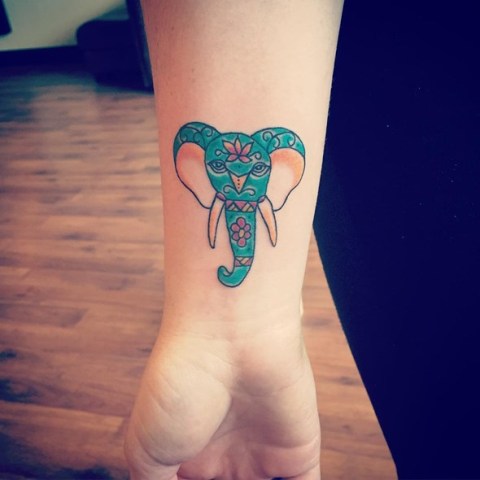 Green and pink elephant on the wrist