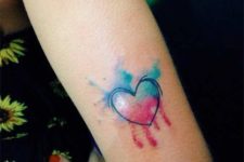 Light blue and pink tattoo on the arm