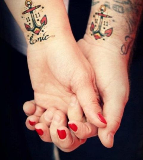 Matching red and black tattoos