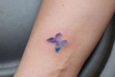 Purple and blue butterfly on the arm