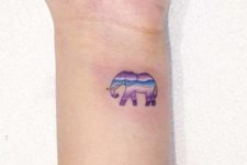 Purple, white and blue elephant on the wrist