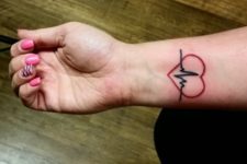 Red and black heartbeat tattoo