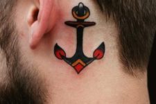 Red, black and orange anchor behind the ear
