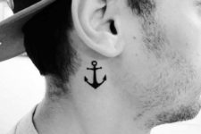 Small anchor tattoo behind the ears