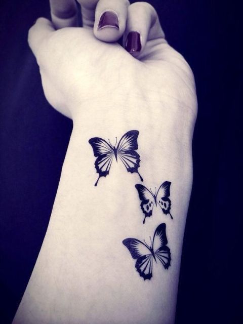 Three little butterflies on the wrist