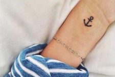 Tiny anchor tattoo on the left wrist