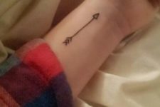 Tiny arrow on the left wrist