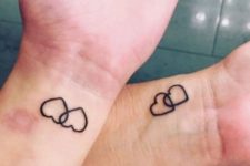 Two hearts tattoo on the wrist
