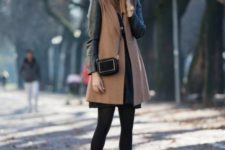 With black dress, black tights and crossbody bag
