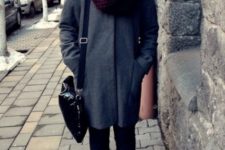 With dark gray coat, black bag, pants and boots