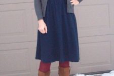 With knee-length blue dress, belt, gray cardigan and high boots