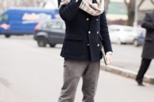 With light gray trousers, navy blue double-breasted jacket and suede boots