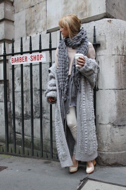 With light pink sweater, white pants and knitted long cardigan