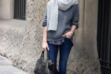 With loose sweater, cuffed jeans, shoes and simple bag