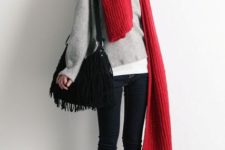With loose sweatshirt, skinnies, boots and fringe bag