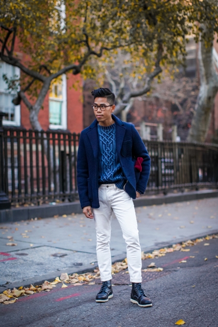 With navy blue short coat, white pants and black boots