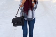 With skinnies, striped shirt, high boots and chain strap bag