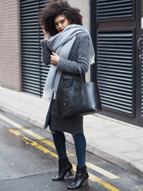With skinny jeans, straight coat, black tote and ankle boots