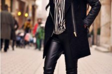 With striped shirt, leather pants and flat ankle boots
