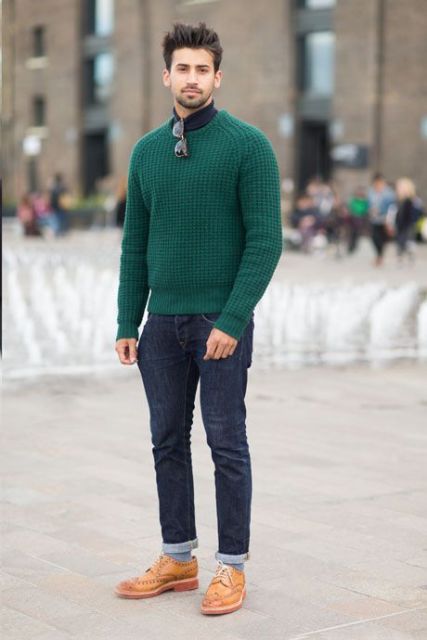With turtleneck, cuffed jeans and brown shoes