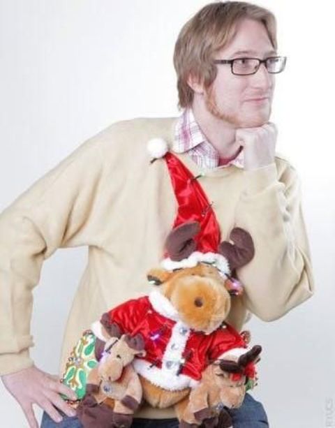 sweater with a plush reindeer in a hat