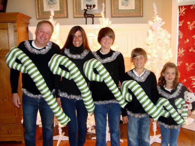 ugly family look with an oversized candy cane