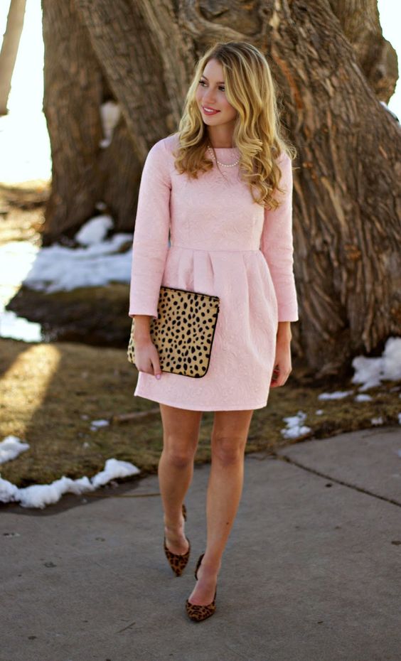 a blush mini dress with leopard heels and a clutch