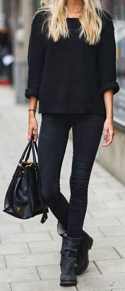 black denim, a chunky knit sweater, flat boots and a tote work well as a winter work outfit