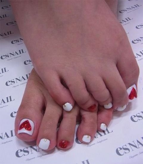 red and white Valentine's Day nails with glitter hearts