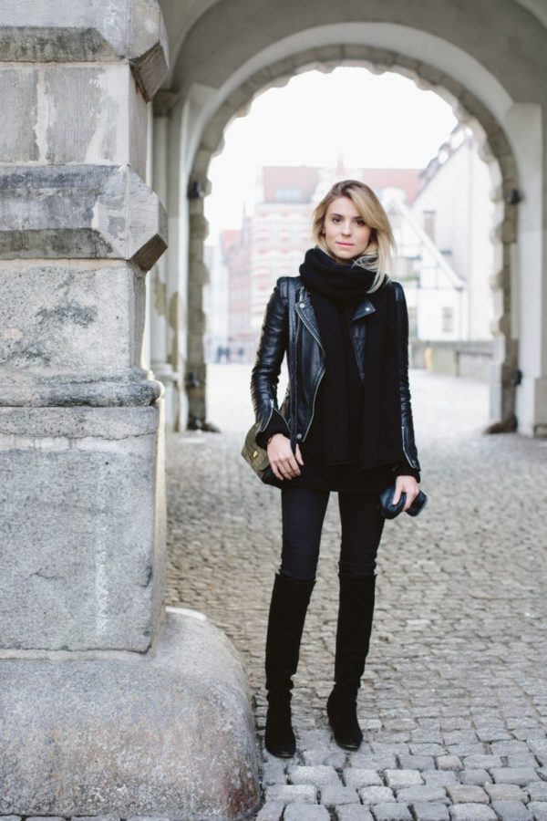 black denim, suede flat boots, a sweater and a scarf with a leather jacket