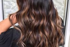 09 wavy black hair with caramel highlights looks natural