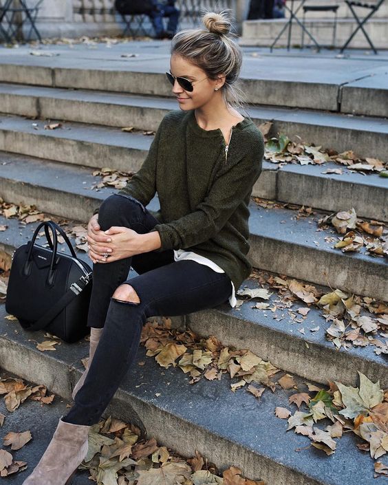 black ripped jeans, brown suede booties and an army green sweater