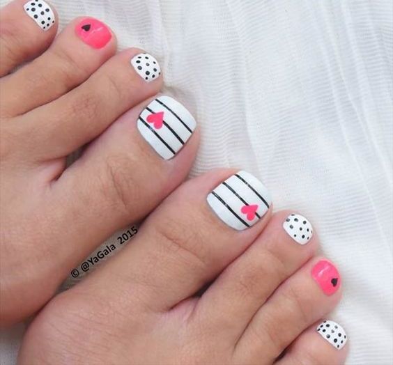 black, white and pink toe nails with polka dots, stripes and hearts