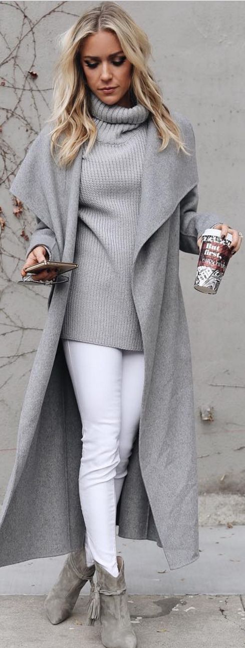 white jeans, grey ankle boots, a grey sweater and a long coat