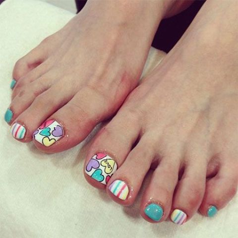 colorful toe nails with stripes and hearts
