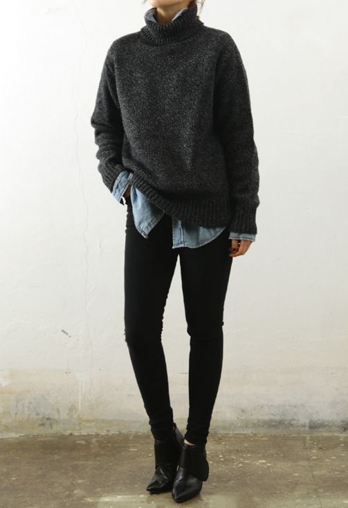 black denim, a chambray shirt, an oversized black sweater and ankle boots