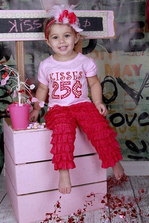 hot red ruffle pants, a pink printed tee and a headpiece