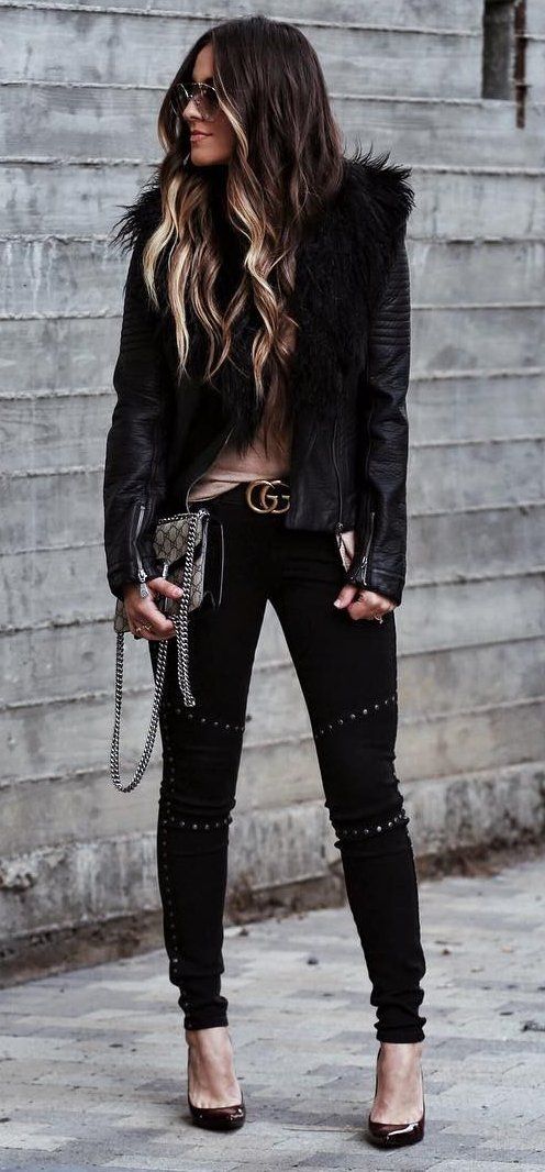 black pumps, black denim, a brown top and a black leather jacket with fur