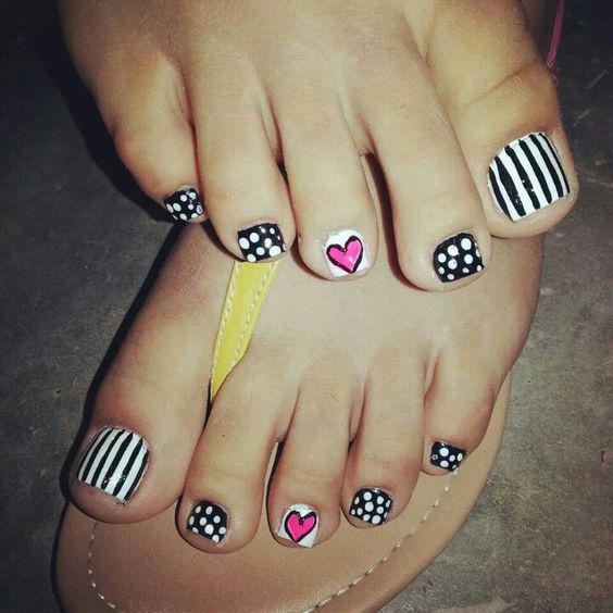 whimsy graphic nail art with stripes, polka dots and hearts
