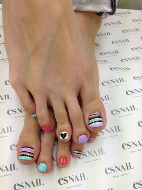 whimsy colorful pedicure wwith stripes and hearts