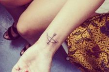 Arrow and bow tattoo on the wrist