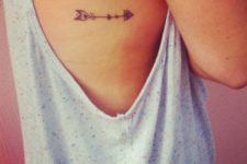 Arrow tattoo on the right side