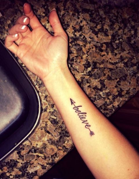 Arrow with word believe tattoo